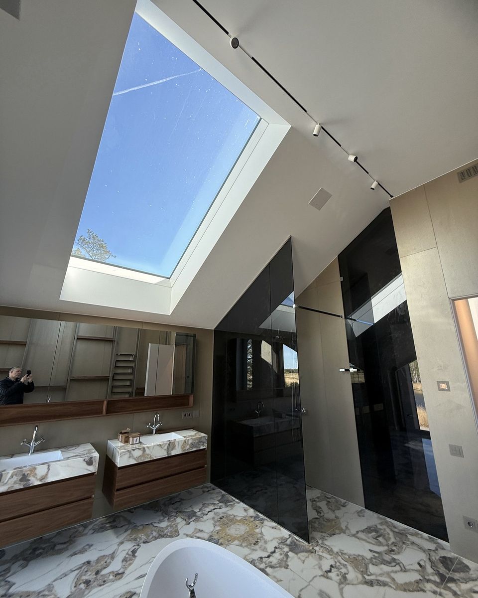 Bathroom with a large 1.6 by 2.7 metre rooflight over the bath