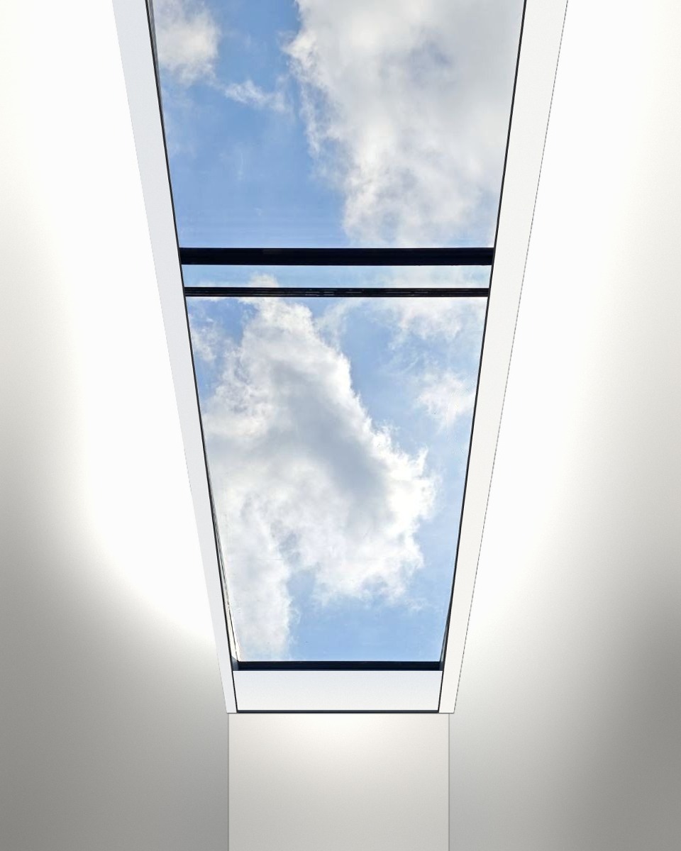 Looking up through the finished nearly 5.9 m unit, white reveal, sky above